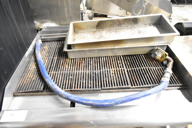 APW Wyott HCRB-2436i stainless steel charbroiler grill, natural gas, worn condition, includes blue gas hose.