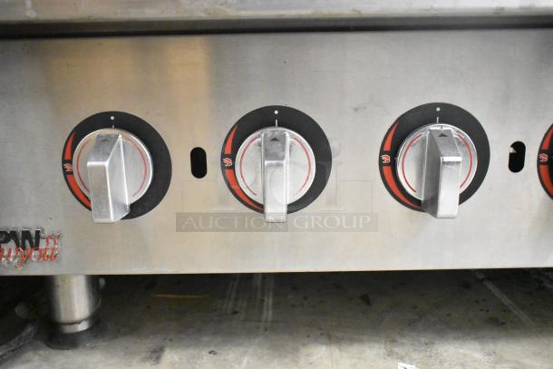 APW Wyott HCRB-2436i stainless steel charbroiler grill with three knobs, showcasing control panel. Used condition.