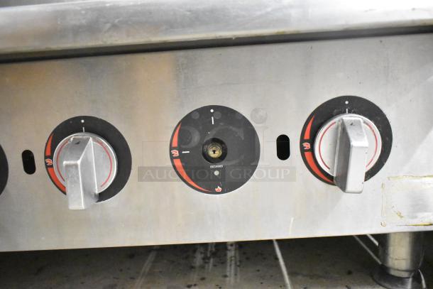 APW Wyott HCRB-2436i natural gas charbroiler controls, stainless steel, visible dials, commercial use.