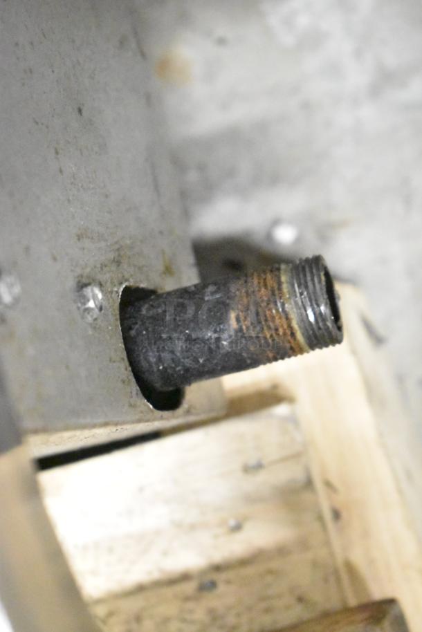 APW Wyott HCRB-2436i charbroiler gas connector, showing a rusted threaded metal pipe.