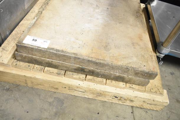 Two pizza oven stones on a wooden pallet, used condition, label showing lot number 59 and quantity as two.