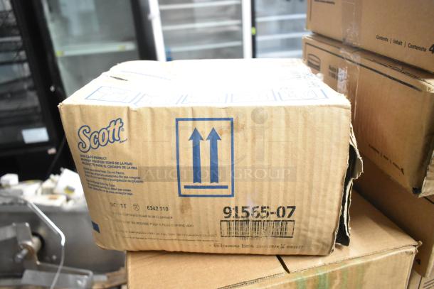 Four new boxes, including Purell sanitizer dispenser, Scott foam skin cleanser, Aqua Sparkle detergent. Scott box visible.