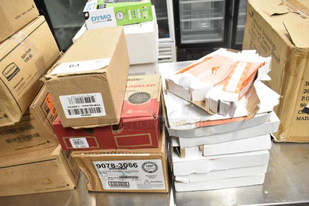 10 brand new boxes including Avery Dennison Monarch 1130 labeler, Nickel rolls, and 9078-3066 thermal receipt printer rolls.