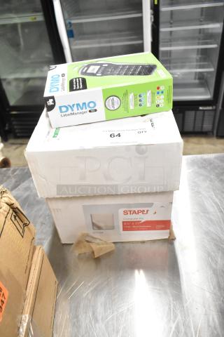 Brand new Dymo LabelManager 160 box and Staples computer paper box, sealed and unopened, 2500 sheets, micro-perforated.