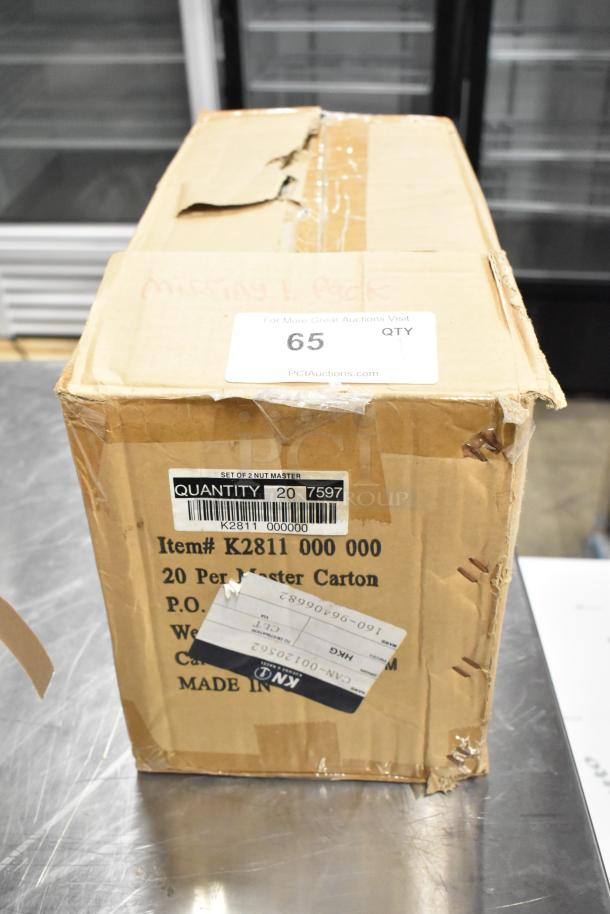 Brand new box of Nut Master Mut Crackers, 20 per carton. Item #K2811 000 000. Box shows signs of damage. Quantity 65.