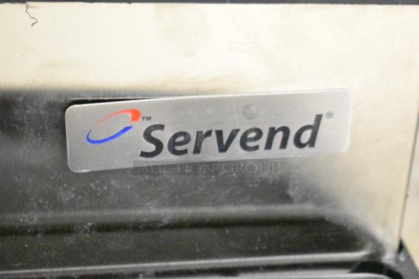 Servend SV150 beverage machine label, showing brand logo. Metal with visible wear. 6-flavor dispenser with ice. 115V.