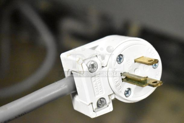 Close-up of a Leviton 125V electrical plug for Kool Star KSR49-S cooler, showing prongs and assembly screws.