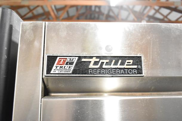 True T-49 stainless steel commercial cooler, two-door, poly-coated racks, commercial casters, 115V, 1 phase.