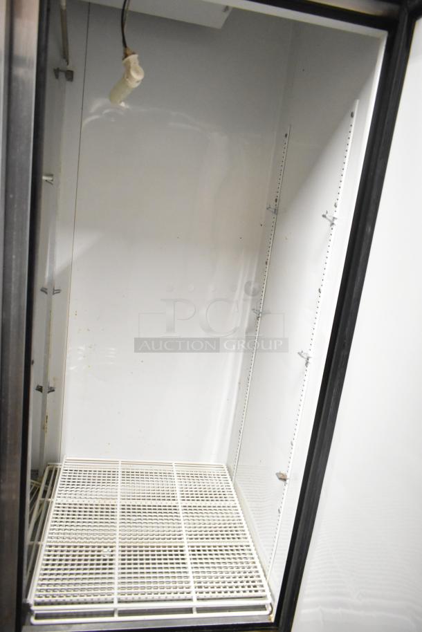 True T-49 stainless steel commercial 2-door reach-in cooler, poly-coated racks, commercial casters, 115V, 1-phase.