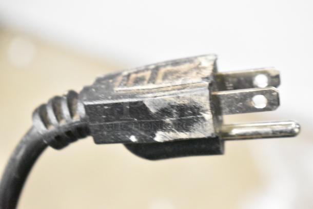 Close-up of a worn electrical plug for the Marchia MDC161 Metal Countertop Deli Display Case Merchandiser.