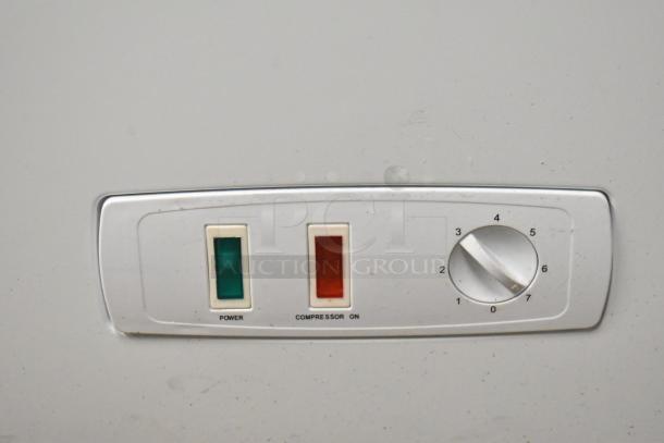Control panel of Atosa MWF9010GR metal chest freezer with power and compressor indicators, temperature dial.