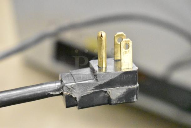 Power plug for Atosa MWF9010GR chest freezer, 115 volts, 1 phase; features a durable black cord and metal prongs.