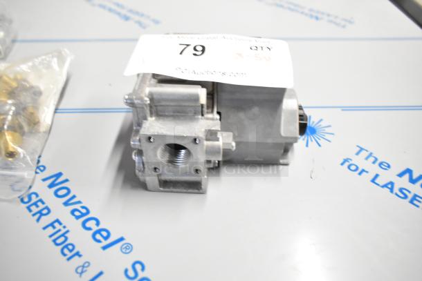 Brand new HP4530799 Garland valve for natural gas, model 4530799, shown with auction label and parts bag.