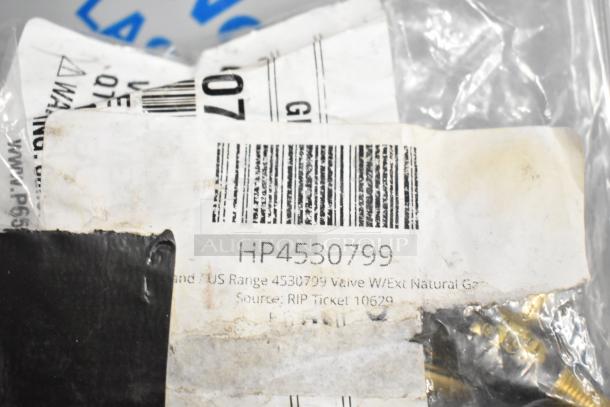 Bag containing new Garland HP4530799 natural gas valve, with visible barcode label, in packaging.