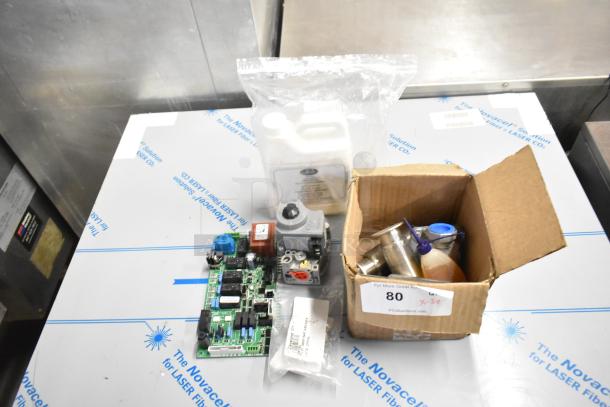 5 new scratch and dent items, including Cleveland 105784 part, metal legs, lubricating oil, circuit board, and parts.