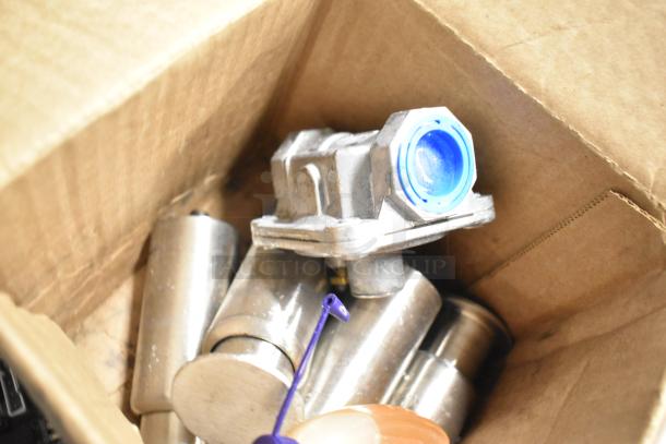 Box of new scratch and dent items, including Cleveland 105784 Plt Asy;Nat, metal legs, and food grade lubricating oil.