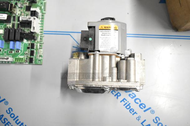 Brand new Cleveland 105784 Plt Asy part, shown with warning label. Includes five items like metal legs, lubricating oil.