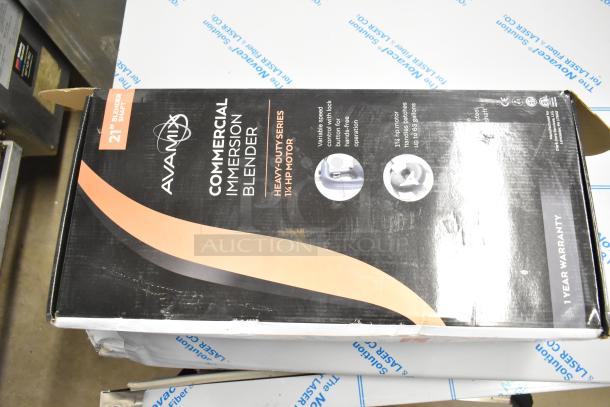 "Brand new Avamix 928IBHD21 21-inch heavy-duty immersion blender in box, 1 1/4 hp, 120V. Minor box damage visible."