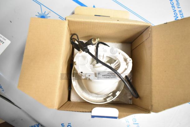 Analog CCTV camera in original box, new condition, with cables and model label visible.