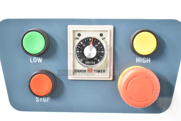 Control panel of Estella 348SM60 dough mixer showing timer and speed controls: low, high, and stop buttons.