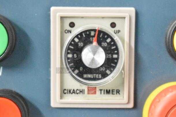 Close-up of a Cikachi timer from the Estella 348SM60 spiral dough mixer, showing minute settings and control panel.
