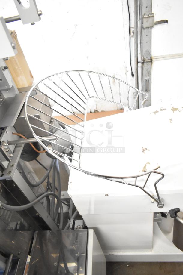 Estella 348SM60 metal spiral dough mixer, 60 qt capacity, with metal bowl, bowl guard, and dough hook. Condition shows wear.