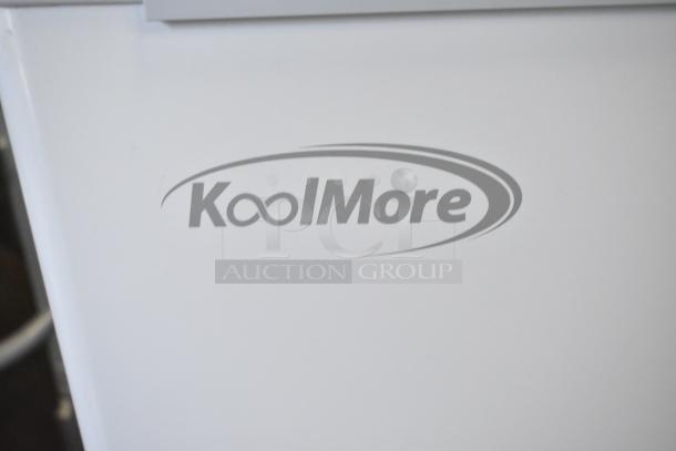 Brand new KoolMore SCF-24C metal commercial chest freezer, 24 cu ft, 115V, labeled with KoolMore logo. Scratch and dent condition.