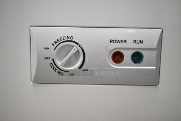 KoolMore SCF-24C chest freezer control panel, showing freezing/cooling dial and power/run indicator lights.