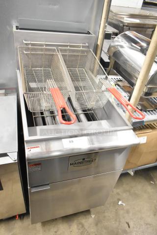 Brand new 2025 Mainstreet 541FF100L stainless steel commercial floor fryer, 70-100 lb. capacity, 150,000 BTU, with 2 fry baskets.