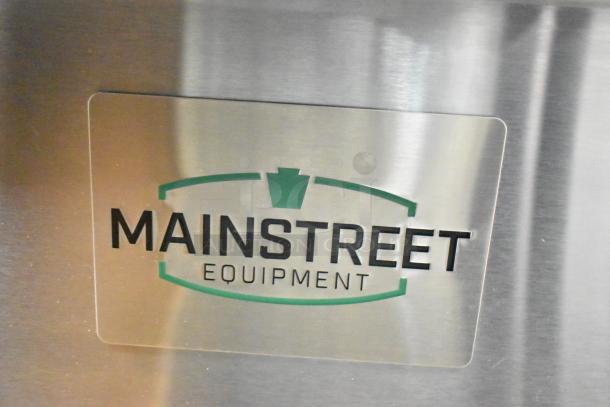 Stainless steel plate with Mainstreet Equipment logo, part of a commercial fryer model 541FF100L.
