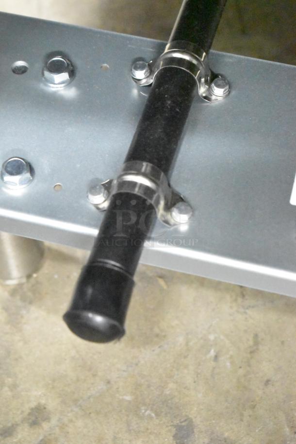 Mainstreet 541FF100L fryer base, showing bolts and piping. Stainless steel design. New with minor scratches. 150,000 BTU.