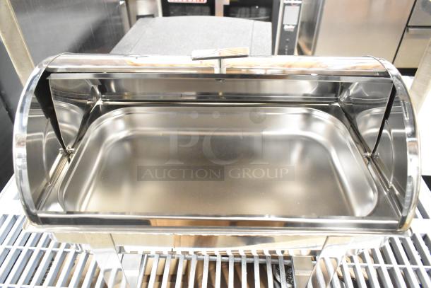 Stainless steel countertop chafing dish, excellent condition, reflecting light. Features a roll-top lid, ideal for buffets.