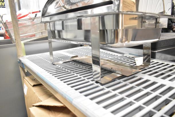 Stainless steel countertop chafing dish with stand, shiny finish, excellent condition, ideal for catering or buffet use.