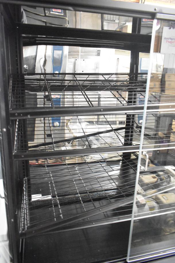 Marco Display Specialties metal bakery merchandiser cabinet, features glass doors and three wire shelves, condition appears used.