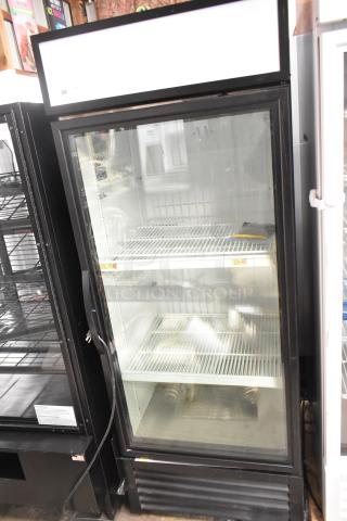 2023 True GDM-26F-HC single door freezer merchandiser with poly coated racks. Metal exterior, 115V, 1 phase, excellent condition.