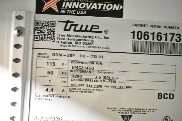 2023 True GDM-26F-HC metal commercial single-door freezer label. Features 115V, R290 refrigerant, poly-coated racks.