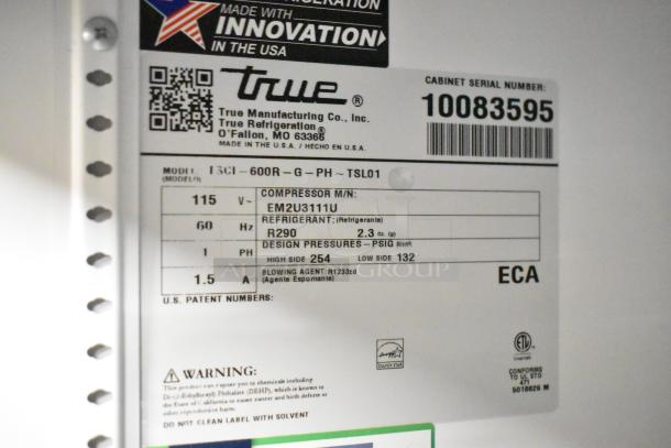 2020 True TSCI-600R-G-PH single door cooler, 115V, featuring poly coated racks, serial number 10083595, Energy Star certified.