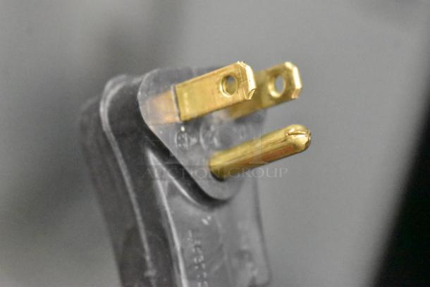 Close-up of a three-prong electrical plug from the 2019 Habco SE18 reach-in cooler. Plug is in good condition.