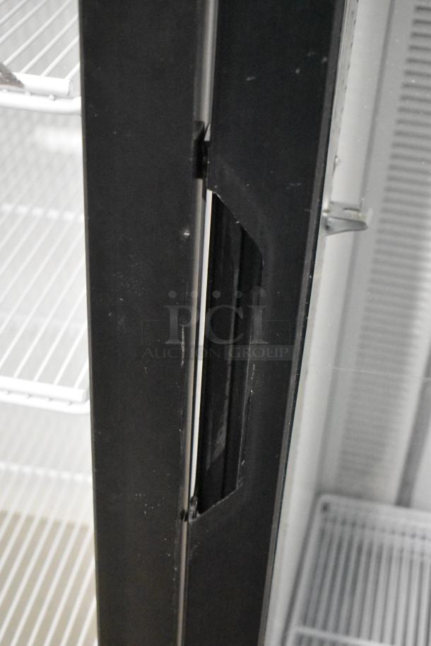 2019 Habco SE18 metal commercial single door reach-in cooler with poly-coated racks, 115V, 1 phase, interior view.