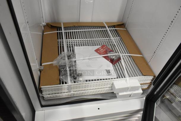 Brand new True TSCI-600R-G-PH commercial cooler. Includes poly-coated racks and accessories. 115V, 1 phase. Minor scratches.