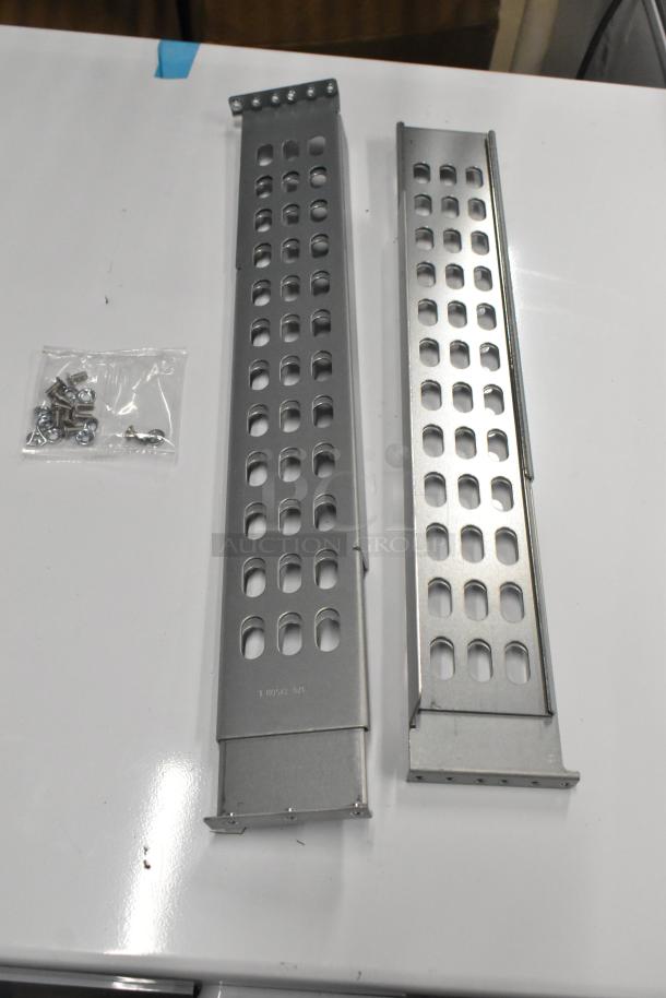 Two brand new poly-coated racks with perforated design, minor scratches. Includes mounting hardware.