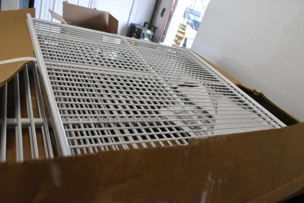 New poly coated racks, boxed, minor scratches and dents; enhances storage. Doubles bid value.