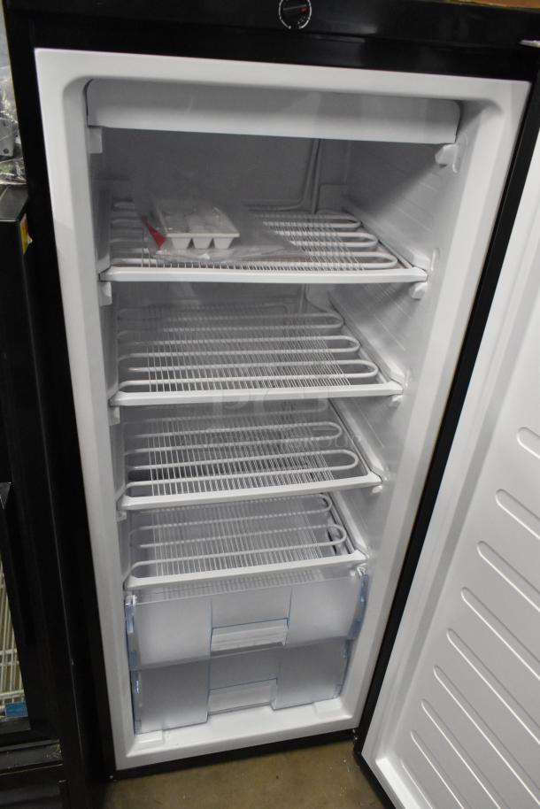 Frigidaire FGFRF1008 metal single door reach-in freezer, five shelves, digital controls, 115 volts, excellent condition.
