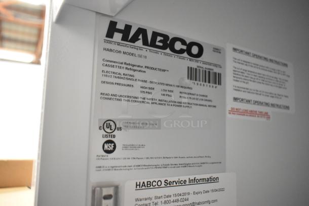 2019 Habco SE18 metal single door commercial cooler. Features poly coated racks, 115V, 1 phase. Labels show model, specs.