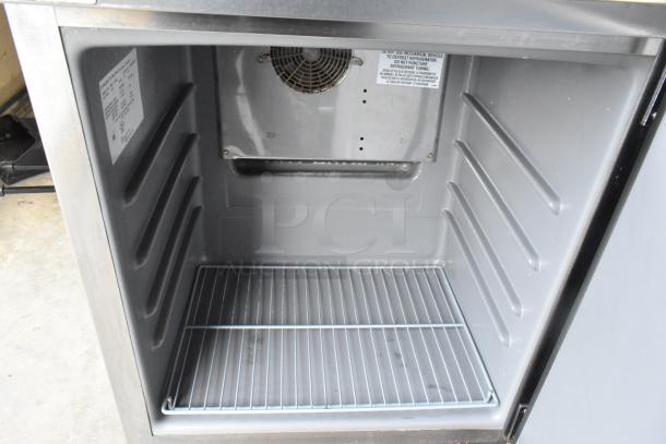 2020 Delfield 406P-STAR2 stainless steel undercounter cooler, single door, with commercial casters. Interior fan visible.