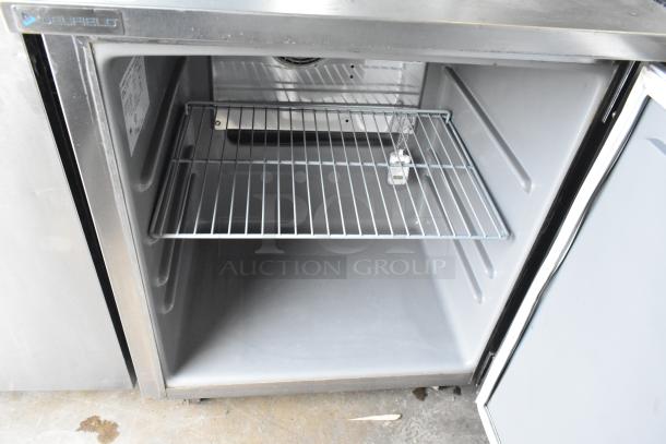 2020 Delfield 406P-STAR2 stainless steel single door undercounter cooler with wire shelf and commercial casters.