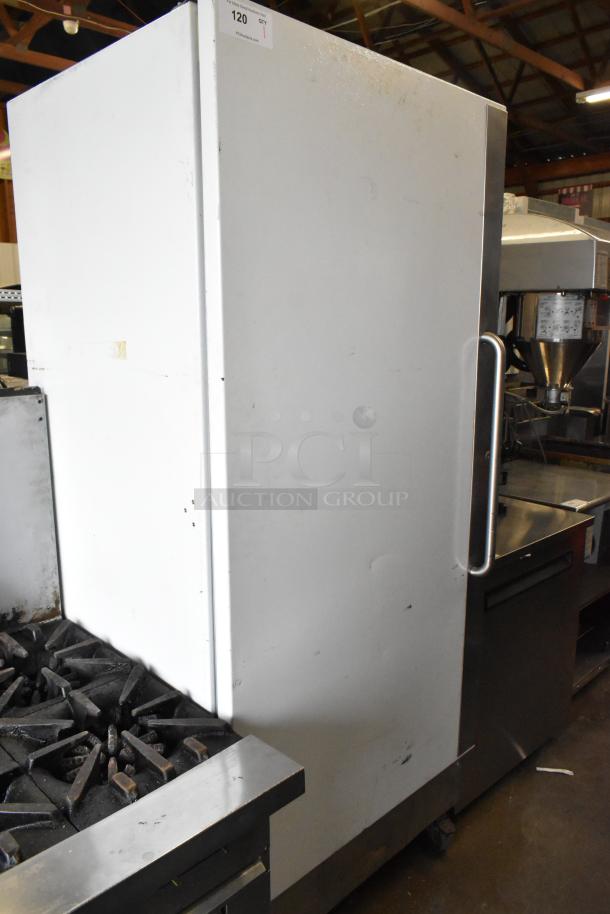 Arctic Air F22CW7 metal reach-in freezer with single door, on commercial casters. 115 volts, 1 phase. Visible wear.