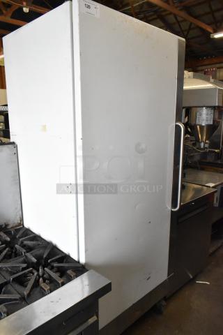 Arctic Air F22CW7 metal reach-in freezer with single door, on commercial casters. 115 volts, 1 phase. Visible wear.