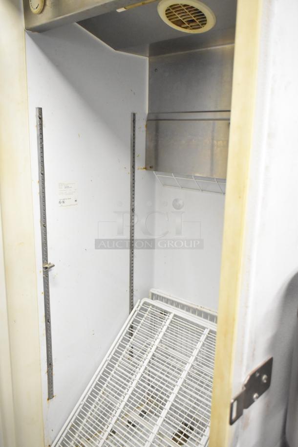 Arctic Air F22CW7 single door freezer, metal interior, wire shelving, used condition, commercial casters, 115V, 1 phase.