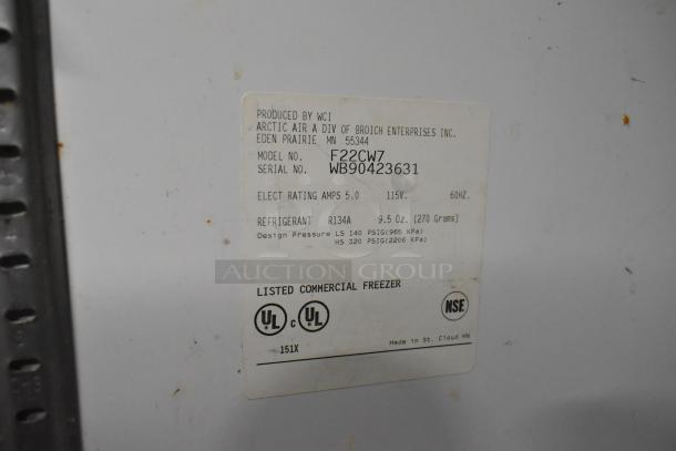 Arctic Air F22CW7 metal single door freezer, 115 volts, commercial casters. Features label with model and serial number.